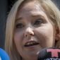 In this Aug. 27, 2019, file photo, Virginia Roberts Giuffre, a sexual assault victim, speaks in New York. Newly unsealed court documents provide a fresh glimpse into a fierce civil court fight between Jeffrey Epstein's ex-girlfriend, Ghislaine Maxwell, and one of the women who accused the couple of sexual abuse. The documents released Thursday, July 30, 2020, were from a now-settled defamation lawsuit filed by one of Epstein's alleged victims, Giuffre. (AP Photo/Bebeto Matthews, File) **FILE**