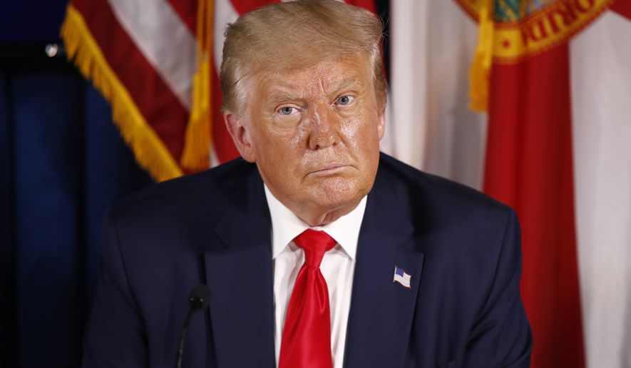President Donald Trump participates in a roundtable discussion on the coronavirus outbreak and storm preparedness at Pelican Golf Club in Belleair, Fla., Friday, July 31, 2020. (AP Photo/Patrick Semansky)