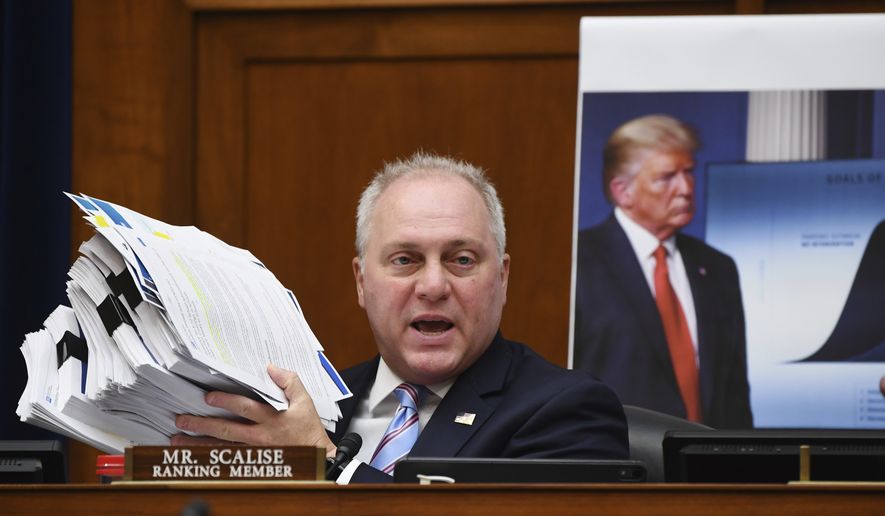 Rep. Steve Scalise, R-La., holds up documents detailing President Donald Trump&#39;s plan for dealing with the coronavirus during a House Subcommittee on the Coronavirus crisis hearing, Friday, July 31, 2020, on Capitol Hill in Washington. (Kevin Dietsch/Pool via AP)