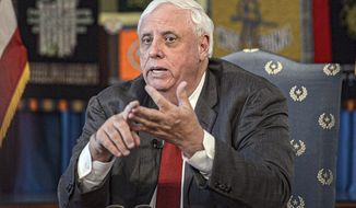 FILE - In this March 12, 2020, file photo, West Virginia Gov. Jim Justice speaks during a press conference at the State Capitol in Charleston, W.Va. Ben Salango, the Democratic candidate for West Virginia governor on Friday, July 31, 2020, said that he has agreed to debate Gov. Jim Justice five times before the November election and called on the Republican incumbent to sign on as well. (F. Brian Ferguson/Charleston Gazette-Mail via AP)