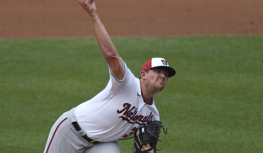 Washington National pitcher Will Harris delivers a pitch during an intersquad baseball game at Nationals Park in Washington, Friday, July 17, 2020. (AP Photo/Susan Walsh)