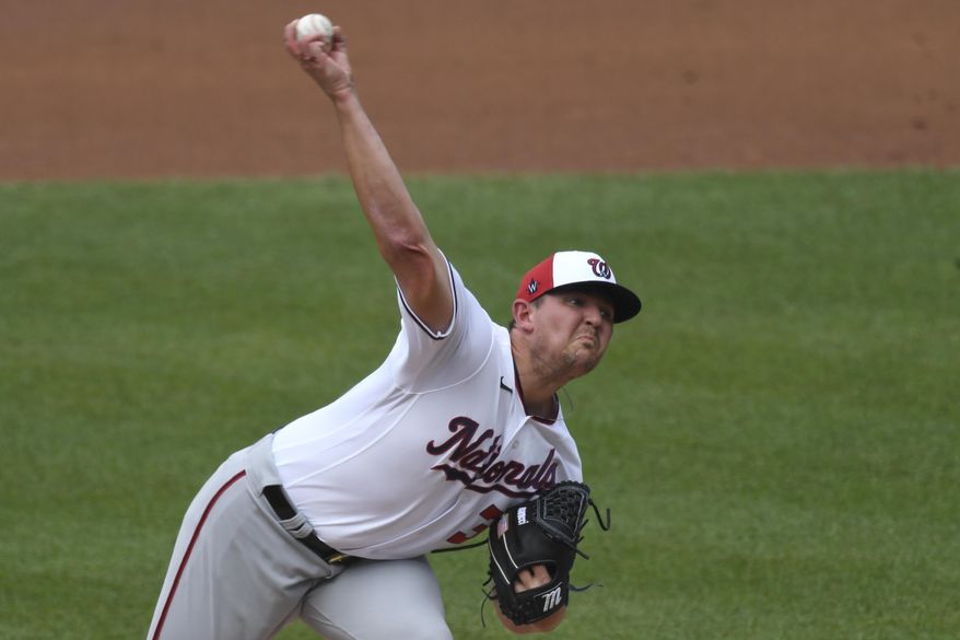 Washington National pitcher Will Harris delivers a pitch during an intersquad baseball game at Nationals Park in Washington, Friday, July 17, 2020. (AP Photo/Susan Walsh)