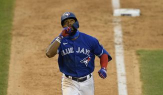 Toronto Blue Jays&#x27; Teoscar Hernandez reacts as he heads home on his home run during the eighth inning of a baseball game against the Washington Nationals, Thursday, July 30, 2020, in Washington. The Nationals won 6-4.(AP Photo/Nick Wass)