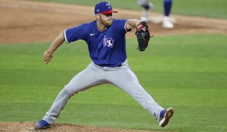 Texas Rangers pitcher Cody Allen throws to the plate during an intrasquad practice baseball game at Globe Life Field in Arlington, Texas, Monday, July 6, 2020. (AP Photo/Tony Gutierrez)
