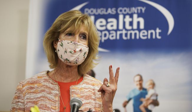 Douglas County Health Director Dr. Adi Pour speaks during a news conference at the Douglas County Health Department in Omaha, Neb., Friday, July 31, 2020. Dr. Pour said she won&#x27;t issue an order requiring people in the county and Omaha to wear masks to help slow the spread of the coronavirus, despite a unanimous vote by the county&#x27;s health board to do so. The rejection of the health board&#x27;s mandate came after Gov. Pete Ricketts and the state attorney general&#x27;s office contacted local authorities to insist that such a requirement would violate state law. (AP Photo/Nati Harnik)
