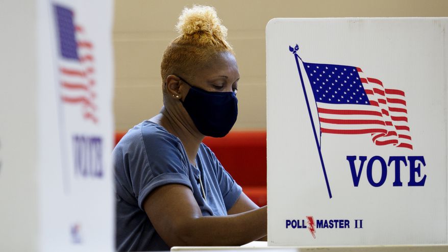 Deborah Thurman votes at the Brainerd Youth and Family Development Center on Saturday, Aug. 1, 2020 in Chattanooga, Tenn. Saturday marked the end of the early voting period. (C.B. Schmelter/Chattanooga Times Free Press via AP)