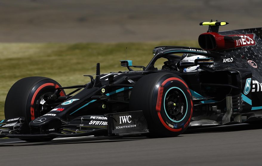 Mercedes driver Valtteri Bottas of Finland steers his car during the third free practice session for the British Formula One Grand Prix at the Silverstone racetrack, Silverstone, England, Saturday, Aug. 1, 2020. The British Formula One Grand Prix will be held on Sunday. (Andrew Boyers/Pool via AP)