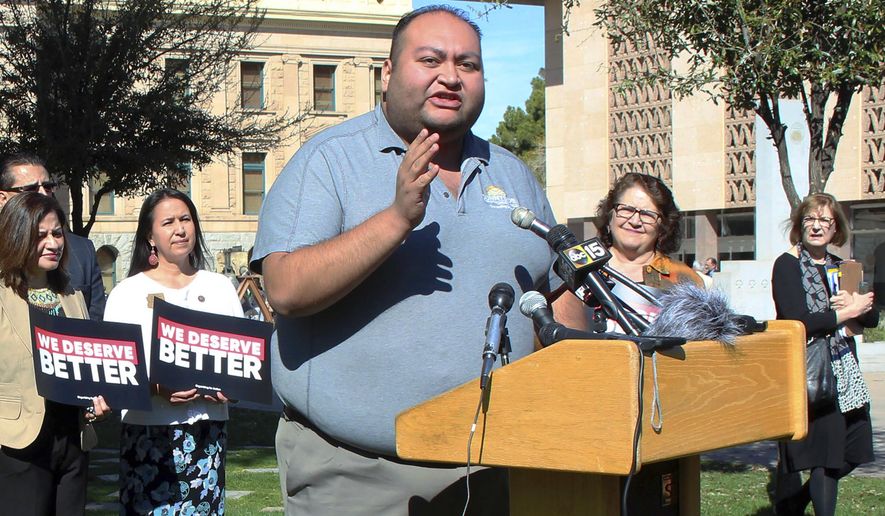 FILE - In this March 12, 2018 file photo, Arizona State Rep. Daniel Hernandez, a Tucson Democrat, speaks during a news conference at the state Capitol in Phoenix. With Democrats eyeing November pickups they hope will give them control of the Arizona Legislature for the first time in decades, business interests are pumping cash into their primaries. But the biggest knock-down, drag-out primary fight pits two sitting lawmakers in a Republican north Phoenix district battling for the soul of the GOP base. (AP Photo/Bob Christie, File)