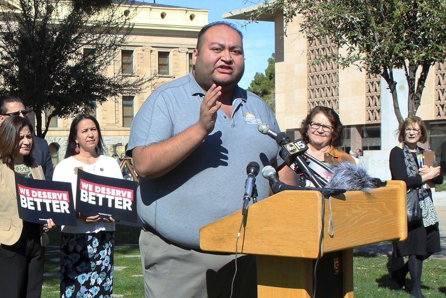 FILE - In this March 12, 2018 file photo, Arizona State Rep. Daniel Hernandez, a Tucson Democrat, speaks during a news conference at the state Capitol in Phoenix. With Democrats eyeing November pickups they hope will give them control of the Arizona Legislature for the first time in decades, business interests are pumping cash into their primaries. But the biggest knock-down, drag-out primary fight pits two sitting lawmakers in a Republican north Phoenix district battling for the soul of the GOP base. (AP Photo/Bob Christie, File)