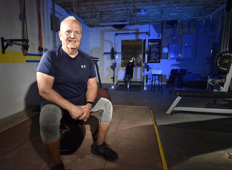 Powerlifter Jeff Beck in his home gym in Honey Brook, Pa., Tuesday July 21, 2020. (Chris Knight/LNP/LancasterOnline via AP)