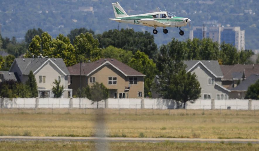 A plane comes in to land at South Valley Regional Airport in West Jordan, Utah, on Tuesday, July 28, 2020. At least eight times in the past 10 years, aircraft crashed near the South Valley Regional Airport in West Jordan. They went down in soccer fields, a few feet from an elementary school, on the New Bingham Highway — and, last Saturday, into houses. (Trent Nelson/The Salt Lake Tribune via AP)
