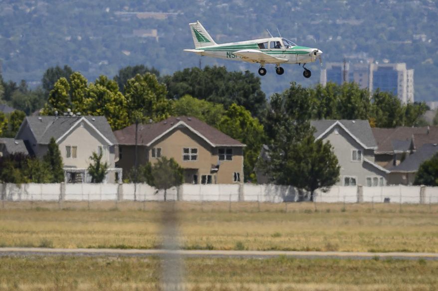 A plane comes in to land at South Valley Regional Airport in West Jordan, Utah, on Tuesday, July 28, 2020. At least eight times in the past 10 years, aircraft crashed near the South Valley Regional Airport in West Jordan. They went down in soccer fields, a few feet from an elementary school, on the New Bingham Highway — and, last Saturday, into houses. (Trent Nelson/The Salt Lake Tribune via AP)