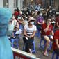 People wait in line for COVID-19 test in Hanoi, Vietnam, Friday, July 31, 2020. Vietnam reported on Friday the country&#39;s first ever death of a person with the coronavirus as it struggles with a renewed outbreak after 99 days without any cases. (AP Photo/Hau Dinh)