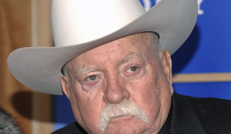 FILE - In this Monday, Dec. 14, 2009 file photo, Actor Wilford Brimley attends the premiere of 'Did You Hear About The Morgans' at the Ziegfeld Theater in New York. Wilford Brimley, who worked his way up from stunt performer to star of film such as “Cocoon” and “The Natural,” has died. He was 85. Brimley’s manager Lynda Bensky said the actor died Saturday morning, Aug. 1, 2020 in a Utah hospital. (AP Photo/Evan Agostini, File)