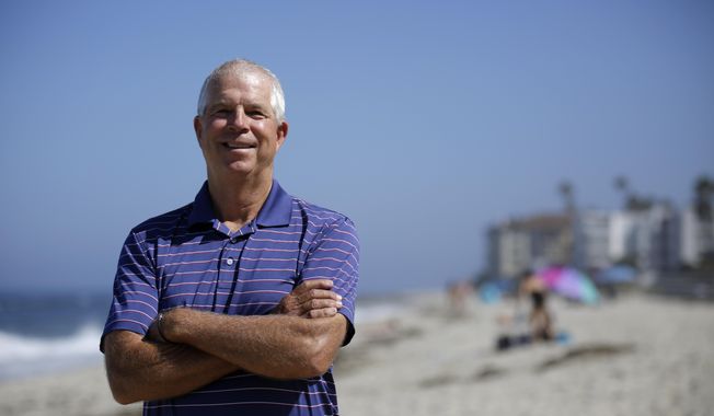Peter Schnugg stands for a portrait along the beach Friday, July 31, 2020, in San Diego. The former waterpolo athlete missed his chance to go to the Olympics in 1980 when the U.S. decided to boycott the games to protest the Soviet Union&#x27;s invasion of Afghanistan. Now he&#x27;s unsure if he&#x27;ll get the chance to see his niece, Maggie Steffens, try for a third consecutive gold medal with the U.S. women&#x27;s water polo team. (AP Photo/Gregory Bull)