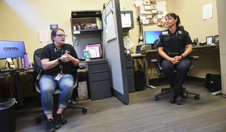 Community Crime Impact Team Mental Health Responders Kenzie Janson-Wolle, left, and Kelly Holden talk about the impact of their work during an interview Monday, July 13, 2020, at the St. Cloud, Minn., Police Department. (Dave Schwarz/The St. Cloud Times via AP)