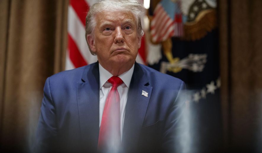 President Donald Trump listens during a meeting with U.S. tech workers, before signing an Executive Order on hiring American workers, in the Cabinet Room of the White House, Monday, Aug. 3, 2020, in Washington. (AP Photo/Alex Brandon) **FILE**