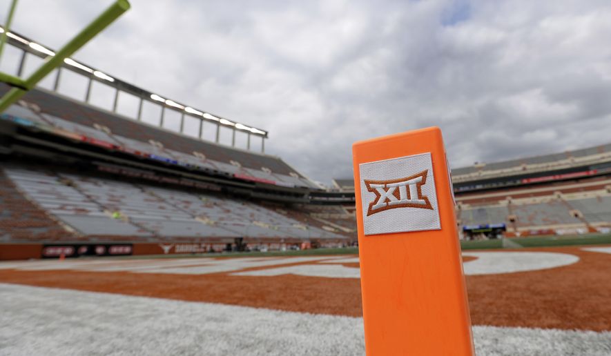 FILE - In this Oct. 7, 2017, file photo, a Big 12 pylon marks the end zone at Darrell K Royal Texas Memorial Stadium before an NCAA college football game between Texas and Kansas State in Austin, Texas. Big 12 schools have agreed to play one nonconference football game this year to go along with their nine league contests as plans for the pandemic-altered season continued to fall into place. (AP Photo/Eric Gay, File)