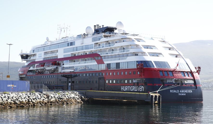 Norwegian cruise ship MS Roald Amundsen moored in Tromso, Norway, Monday Aug. 3, 2020. After 40 people, including four passengers and 26 crew members on the Norwegian cruise ship have been tested positive for the coronavirus, the operator says it was stopping for all cruises with its three vessels. The 40 people were admitted to the University Hospital of North Norway in Tromsoe, north of the Arctic Circle,  where the empty ship has docked. (Terje Pedersen/NTB Scanpix via AP)