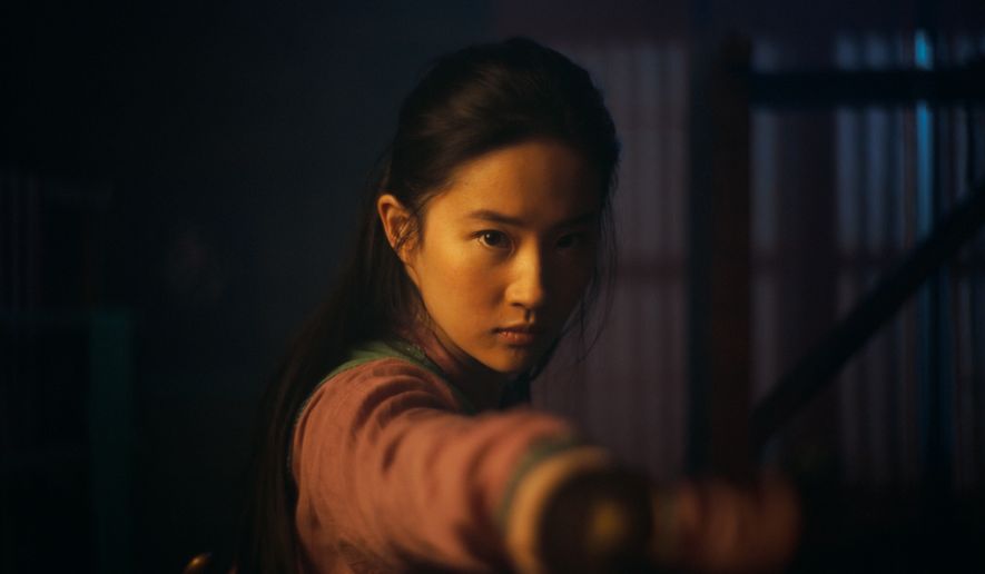 This image released by Disney shows Yifei Liu in the title role of &quot;Mulan.&quot;  The film is no longer headed for a major theatrical release. The Walt Disney Co. said Tuesday that it will debut its live-action blockbuster on its subscription streaming service, Disney+, on Sept. 4. Customers will have to pay an additional $29.99 on top of the cost of the monthly subscription to rent “Mulan.” (Disney Enterprises, Inc. via AP)