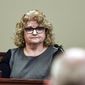 FILE - In this Feb. 14, 2020, file photo, former Michigan State gymnastics coach Kathie Klages testifies in Lansing, Mich. Klages has been sentenced to 90 days in jail, Tuesday, Aug. 4, 2020, for lying to police during an investigation into ex-Olympic and university sports doctor Larry Nassar. She was found guilty by a jury in February of a felony and a misdemeanor for denying she knew of Nassar’s abuse prior to 2016 when survivors started to come forward publicly. (Matthew Dae Smith/Lansing State Journal via AP, File)