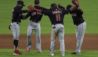 Cleveland Indians&#x27; Francisco Lindor, left, Cesar Hernandez, middle left, Carlos Santana, right, and Jose Ramirez, middle right, celebrate after a baseball game against the Cincinnati Reds in Cincinnati, Tuesday, Aug. 4, 2020. The Indians won 4-2. (AP Photo/Aaron Doster)