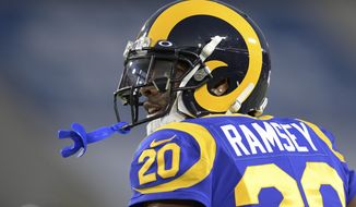 FILE - In this Dec. 8, 2019, file photo, Los Angeles Rams cornerback Jalen Ramsey watches during an NFL football game against the Seattle Seahawks in Los Angeles. Ramsey remains confident he will sign a new contract with the Rams as he heads into the final season of his rookie deal.  (AP Photo/Kyusung Gong, File)