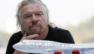 FILE - In this June 16. 2011, file photo, Richard Branson, president of Virgin Atlantic Airways, attends a news conference in Miami Beach, Fla. Branson announced that Virgin was starting flights between London and Cancun, Mexico. Virgin Atlantic, the airline founded by British businessman Branson, filed Tuesday, Aug. 4, 2020, for relief from creditors as the virus pandemic hammers the airline industry. The airline made the filing in U.S. federal bankruptcy court in New York after a proceeding in the United Kingdom. (AP Photo/Wilfredo Lee, File)