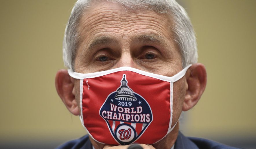 Dr. Anthony Fauci, director of the National Institute for Allergy and Infectious Diseases, listens during a House Subcommittee on the Coronavirus crisis hearing, Friday, July 31, 2020 on Capitol Hill in Washington.  (Kevin Dietsch/Pool via AP)