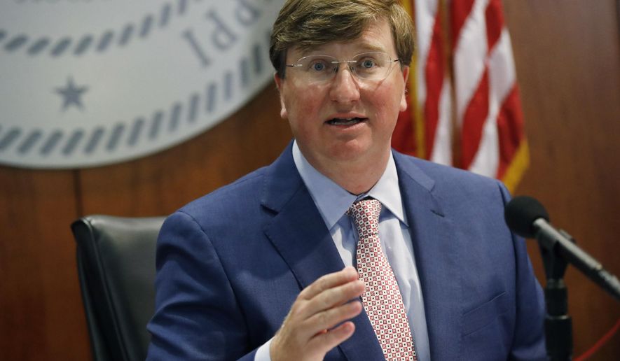 Gov. Tate Reeves discusses his latest executive orders regarding face masking during a coronavirus news briefing, Tuesday, Aug. 4, 2020, in Jackson, Miss. (AP Photo/Rogelio V. Solis)