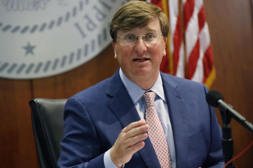 Gov. Tate Reeves discusses his latest executive orders regarding face masking during a coronavirus news briefing, Tuesday, Aug. 4, 2020, in Jackson, Miss. (AP Photo/Rogelio V. Solis)