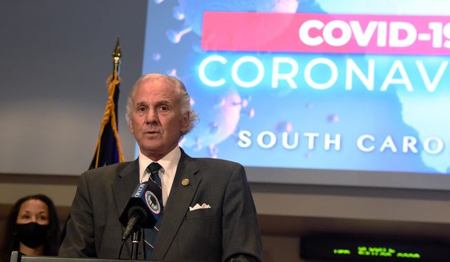 South Carolina Gov. Henry McMaster, right, speaks during a COVID-19 briefing as state epidemiologist Linda Bell, left, looks on, on Wednesday, July 29, 2020, in West Columbia, S.C. As of Monday, McMaster says all businesses will be allowed to be open, as long as they adhere to social distancing and capacity limits. (AP Photo/Meg Kinnard)