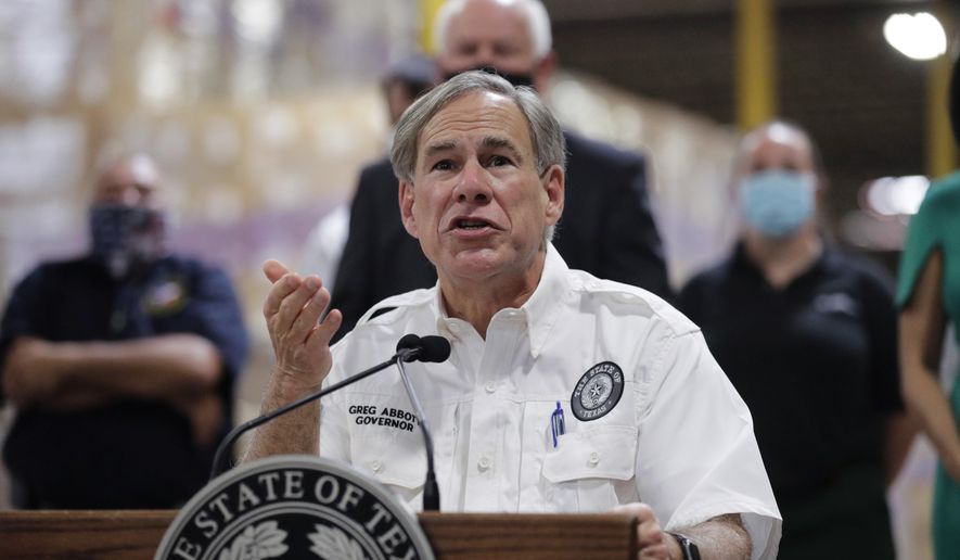Texas Gov. Greg Abbott speaks to the media during a visit to a Texas Division of Emergency Management Warehouse filled with Personal Protective Equipment, Tuesday, Aug. 4, 2020, in San Antonio. (AP Photo/Eric Gay) ** FILE **