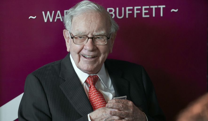 In this May 5, 2019, file photo Warren Buffett, Chairman and CEO of Berkshire Hathaway, smiles as he plays bridge following the annual Berkshire Hathaway shareholders meeting in Omaha, Neb. Buffett&#39;s company has purchased another $400 million of Bank of America stock less than a week after buying roughly $800 million of the bank&#39;s stock. Berkshire Hathaway Inc. said Monday, July 27, 2020 it held 998 million Bank of America shares after the latest purchases, which represents roughly 11.5% of the bank&#39;s stock. (AP Photo/Nati Harnik, File)