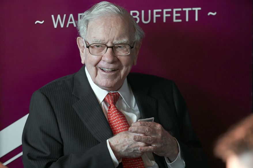 In this May 5, 2019, file photo Warren Buffett, Chairman and CEO of Berkshire Hathaway, smiles as he plays bridge following the annual Berkshire Hathaway shareholders meeting in Omaha, Neb. Buffett&#x27;s company has purchased another $400 million of Bank of America stock less than a week after buying roughly $800 million of the bank&#x27;s stock. Berkshire Hathaway Inc. said Monday, July 27, 2020 it held 998 million Bank of America shares after the latest purchases, which represents roughly 11.5% of the bank&#x27;s stock. (AP Photo/Nati Harnik, File)