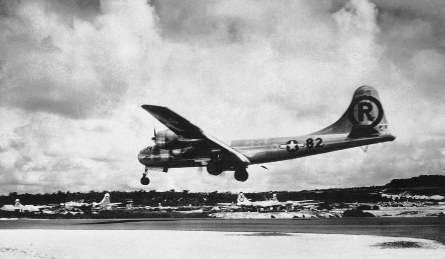 In this Aug. 6, 1945, file photo, the "Enola Gay" Boeing B-29 Superfortress lands at Tinian, Northern Mariana Islands, after the U.S. atomic bombing mission against the Japanese city of Hiroshima. Enola Gay dropped the 4-ton “Little Boy” uranium bomb from a height of 9,600 meters (31,500 feet) on the city center, targeting the Aioi Bridge. (AP Photo/Max Desfor, File)