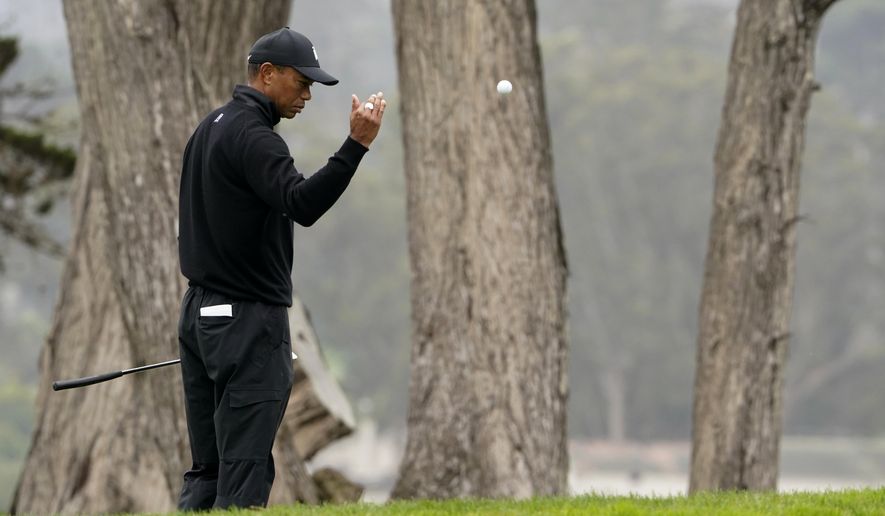 Tiger Woods toss a ball down on the 17th hold during a practice round for the PGA Championship golf tournament at TPC Harding Park Wednesday, Aug. 5, 2020, in San Francisco. (AP Photo/Charlie Riedel)