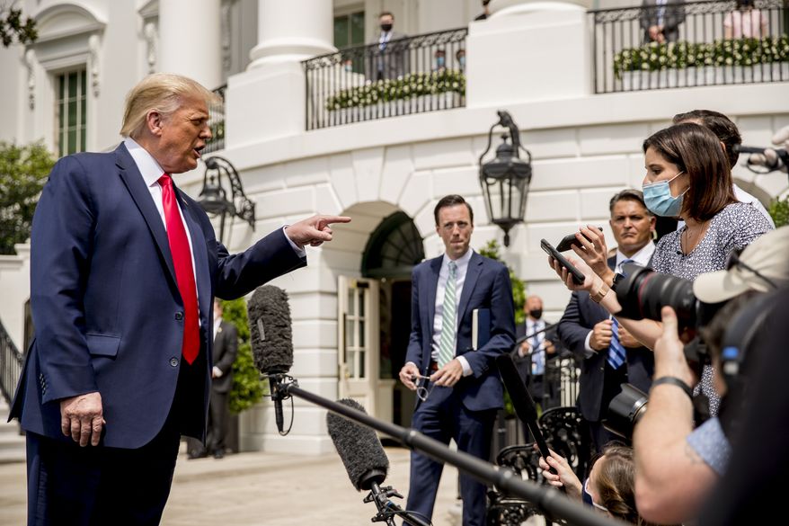 President Donald Trump speaks with members of the media before boarding Marine One on the South Lawn of the White House in Washington, Thursday, Aug. 6, 2020, for a short trip to Andrews Air Force Base, Md. and then on to Cleveland, Ohio. (AP Photo/Andrew Harnik)