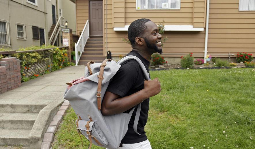 FILE - This May 11, 2017, file photo shows Andre Shavers, who runs a marijuana delivery business, on a street in Oakland, Calif. California faced off in court Thursday, Aug. 6, 2020, against some of its own cities that want to overturn a government rule allowing home marijuana deliveries statewide, even into communities that banned commercial pot sales. (AP Photo/Eric Risberg, File)