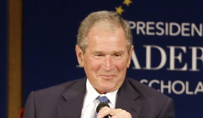 Former President George W. Bush appears during a discussion at the Presidential Leadership Scholars graduation ceremony at the George W. Bush Presidential Center in Dallas on July 13, 2017. Bush will honor American immigrants in a book coming out in March. Bush’s “Out Of Many, One: Portraits of America’s Immigrants” includes 43 portraits by the 43rd president. (AP Photo/Tony Gutierrez, File)
