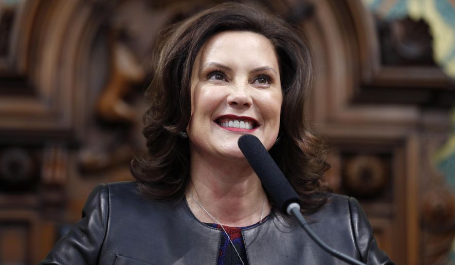 In this Jan. 29, 2020, file photo, Michigan Gov. Gretchen Whitmer delivers her State of the State address to a joint session of the House and Senate, at the state Capitol in Lansing, Mich. (AP Photo/Al Goldis, File)