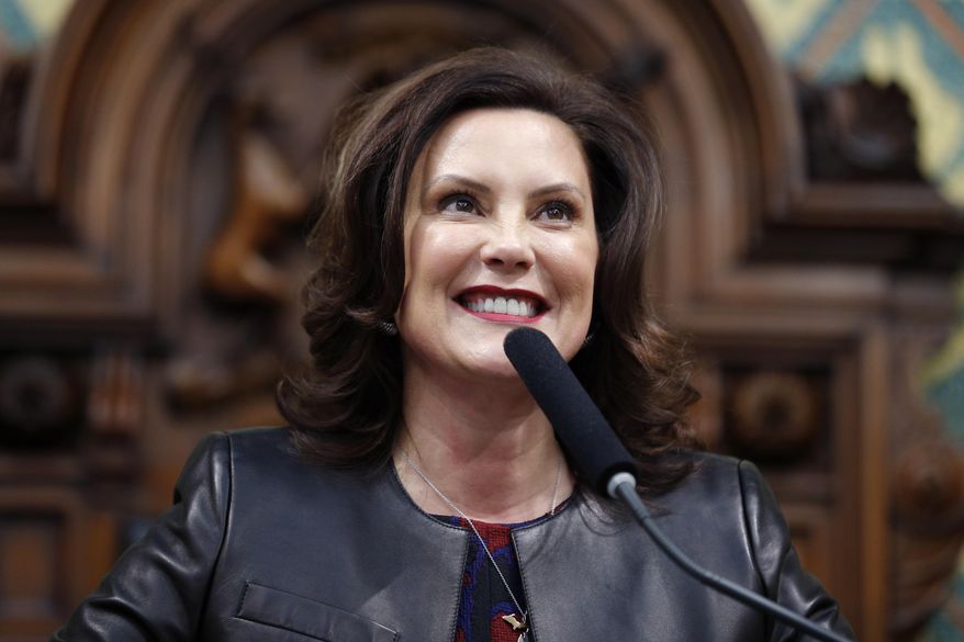 In this Jan. 29, 2020, file photo, Michigan Gov. Gretchen Whitmer delivers her State of the State address to a joint session of the House and Senate, at the state Capitol in Lansing, Mich. (AP Photo/Al Goldis, File)