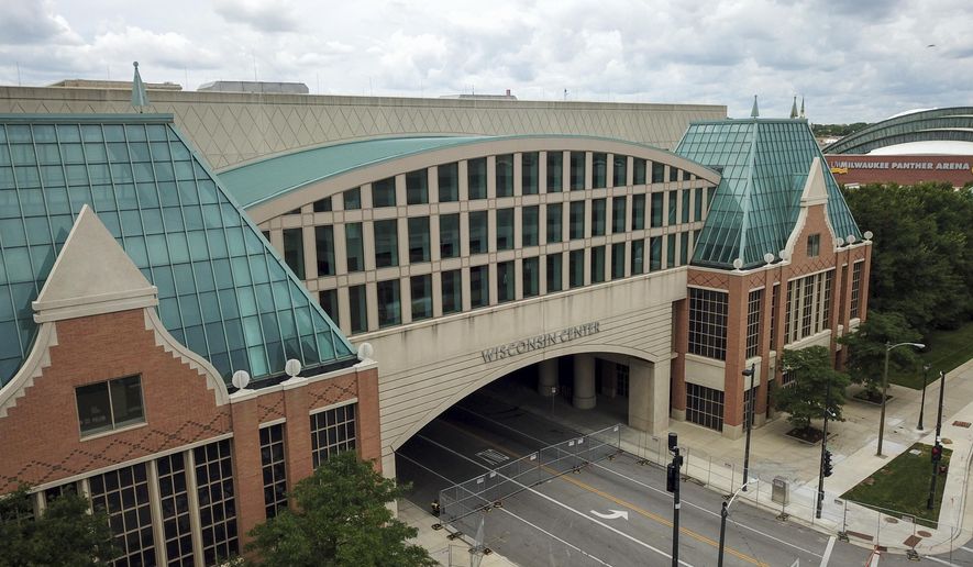The Wisconsin Center is seen Wednesday, Aug. 5, 2020, in Milwaukee. Democratic presidential candidate former Vice President Joe will not travel to Milwaukee to accept the Democratic presidential nomination because of concerns over the coronavirus, party officials said Wednesday, signaling a move to a convention that essentially has become entirely virtual. (AP Photo/Morry Gash)