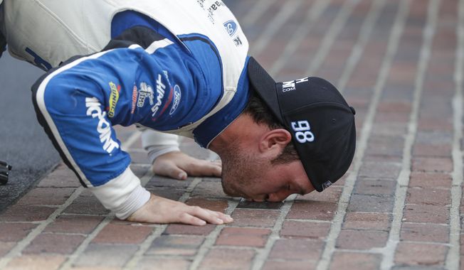 FILE - In this Saturday, July 4, 2020, file photo, NASCAR Xfinity Series driver Chase Briscoe kisses the yard of bricks on the start/finish line after winning the NASCAR Xfinity Series auto race at Indianapolis Motor Speedway in Indianapolis. Briscoe is very clear about his goal of earning a promotion to NASCAR&#x27;s top Cup Series. He&#x27;s made his case this season with an Xfinity Series-leading five victories with an eye on adding another win Saturday on the road course at Road America. (AP Photo/Darron Cummings, File)