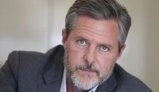  In this Nov. 16, 2016 file photo, Liberty University president Jerry Falwell Jr., poses during an interview in his offices at the school in Lynchburg, Va. (AP Photo/Steve Helber, File)