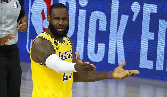 LeBron James of the Los Angeles Lakers reacts to a call against the Oklahoma City Thunder during the second half of an NBA basketball game Wednesday, Aug. 5, 2020, in Lake Buena Vista, Fla. (Kevin C. Cox/Pool Photo via AP)