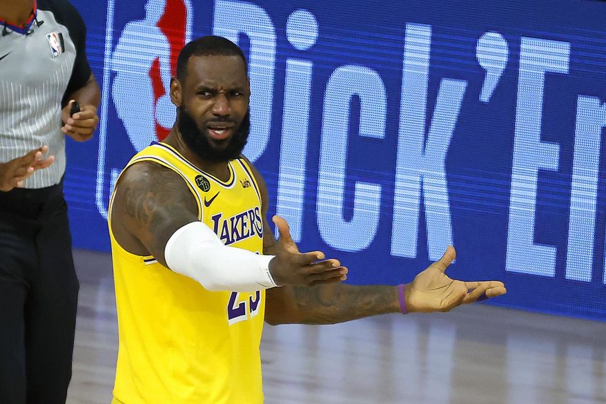 LeBron James of the Los Angeles Lakers reacts to a call against the Oklahoma City Thunder during the second half of an NBA basketball game Wednesday, Aug. 5, 2020, in Lake Buena Vista, Fla. (Kevin C. Cox/Pool Photo via AP)