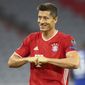 Bayern&#39;s Robert Lewandowski celebrates after scoring his team&#39;s first goal from the penalty spot during the Champions League round of 16 second leg soccer match between Bayern Munich and Chelsea at Allianz Arena in Munich, Germany, Saturday, Aug. 8, 2020. (AP Photo/Matthias Schrader)