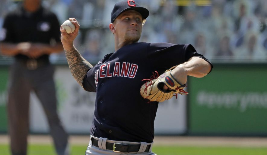 Cleveland Indians starting pitcher Zach Plesac throws against the Chicago White Sox during the first inning of a baseball game in Chicago, Saturday, Aug. 8, 2020. (AP Photo/Nam Y. Huh)
