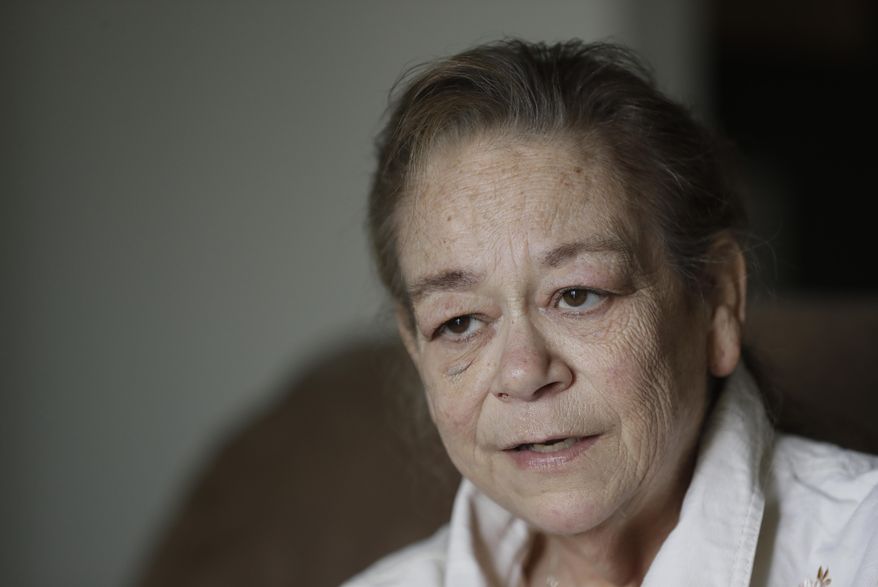 Leesa Huddleston talks about washing dishes and cleaning kitchens at a casino from her home, Monday, Aug. 3, 2020, in Shelbyville, Ind. Huddleston returned in June after a three-month furlough caused by the coronavirus. She felt fortunate to no longer be among the roughly 30 million Americans who remain jobless and are now struggling with suddenly reduced unemployment aid. Yet the return of her job hardly ended Huddleston's financial troubles. Her employer, its revenue shrunken by the loss of customers, cut her schedule to four days a week. (AP Photo/Darron Cummings)